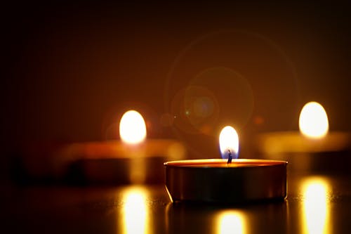 Free Close-up Photography of Lighted Candles Stock Photo