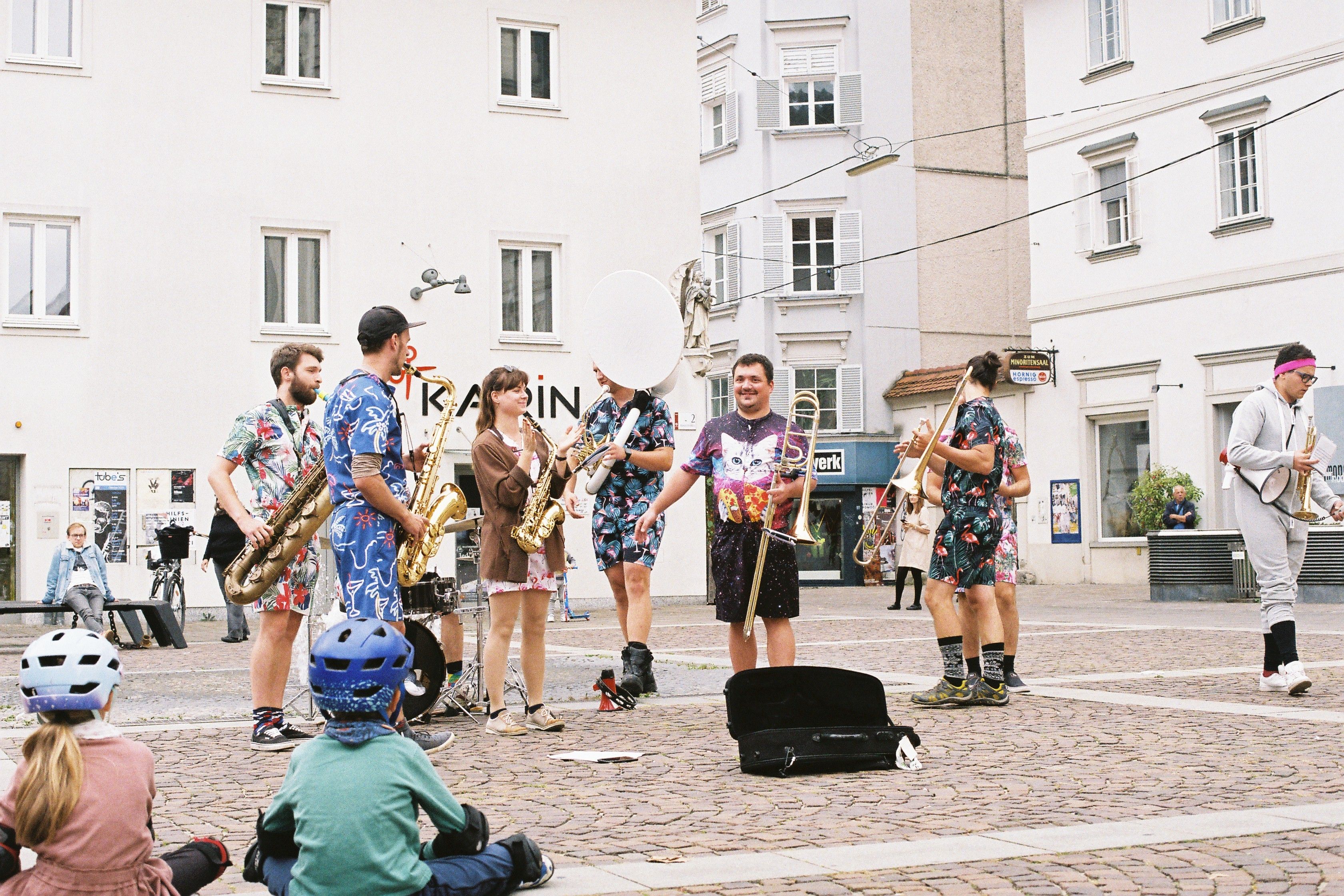 A Group of Musicians Performing with Musical Instruments · Free Stock Photo