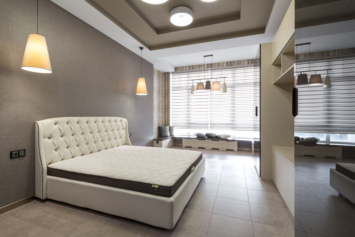 Queen-size mattress in a modern bedroom under $500