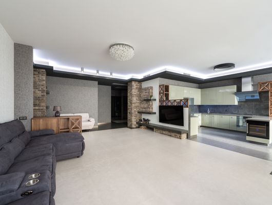 Modern apartment featuring kitchen appliances and LG smart TV