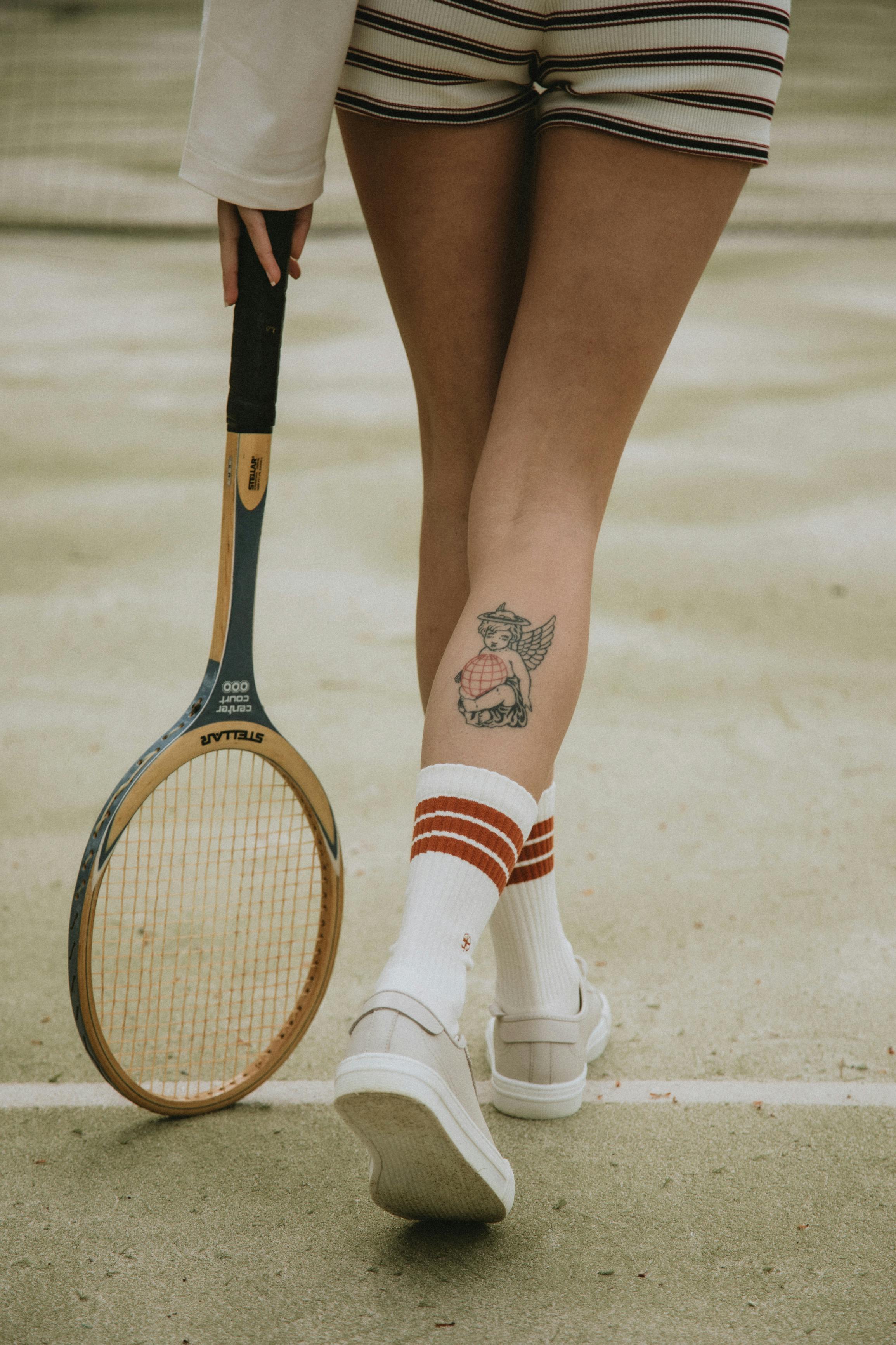 woman holding a tennis racket