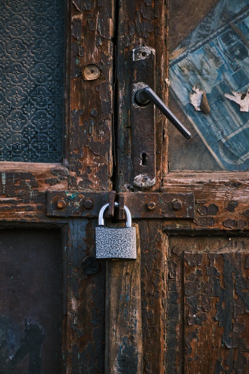 Close-Up Shot of a Locked Wooden Door