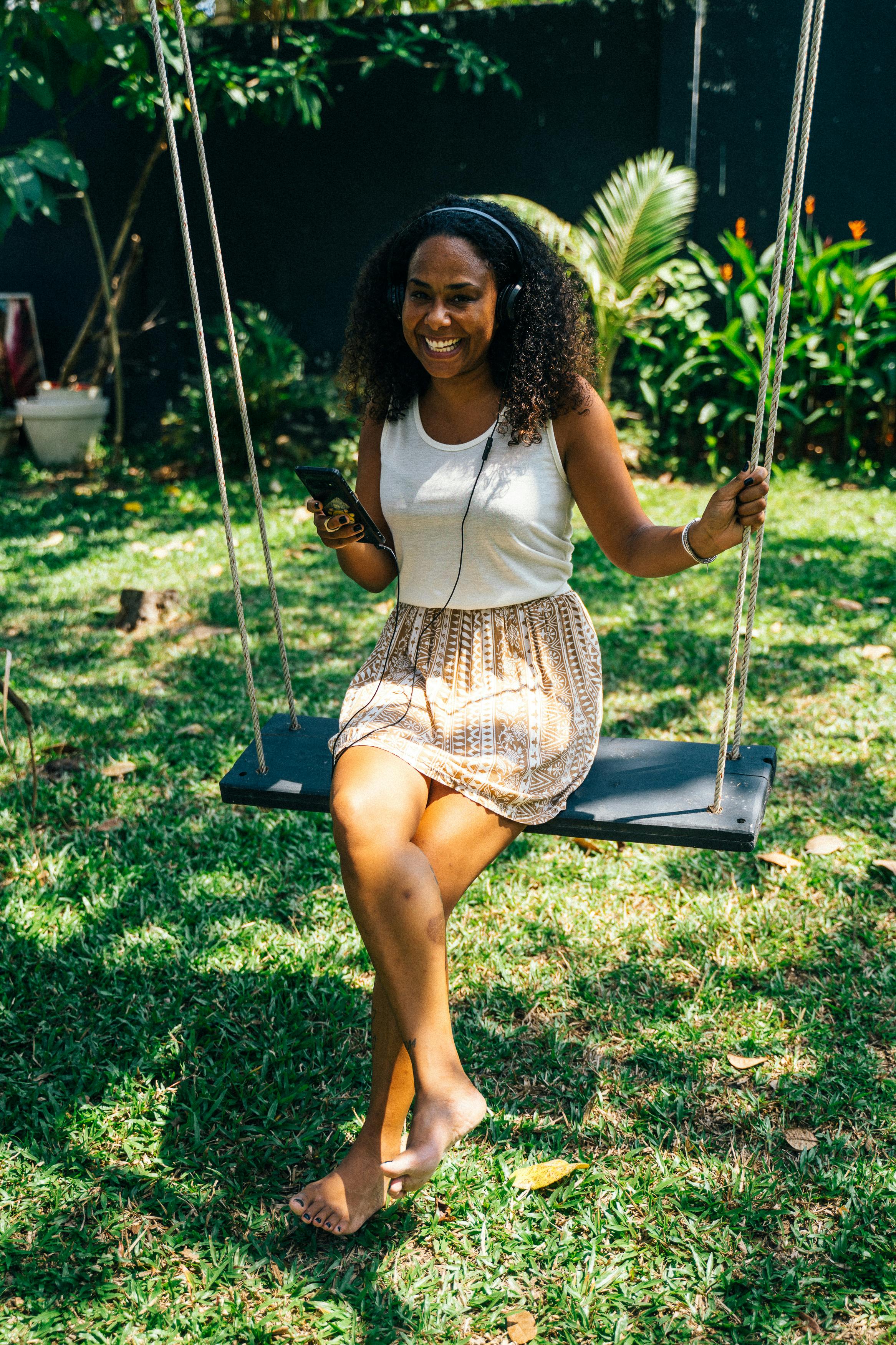 woman sitting on swing