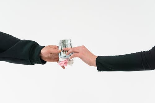 Person Holding Clear Drinking Glass