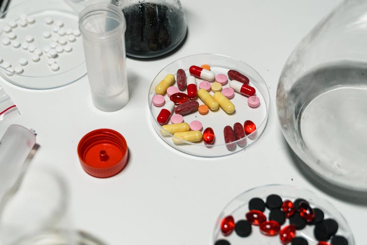 Close-Up Shot Of Medicines On White Surface