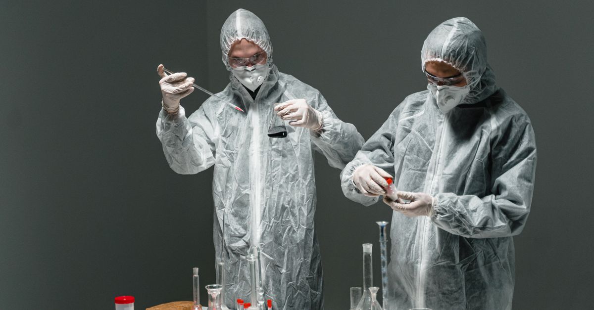 Science Lab Pockets People in Laboratory Suits Doing an Experiment · Free Stock Photo