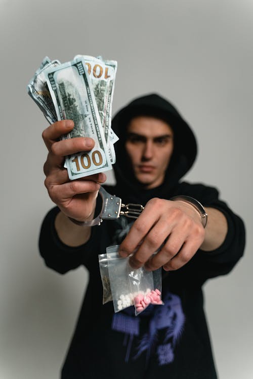 Free A Man in Handcuffs Arrested for Illegal Drugs Trade Stock Photo