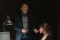 A Man in Suit Jacket Giving Cigarette to a Woman