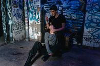 Man and Woman In Room with Graffiti on Wall