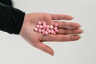 White Round Medication Pill on Persons Palm