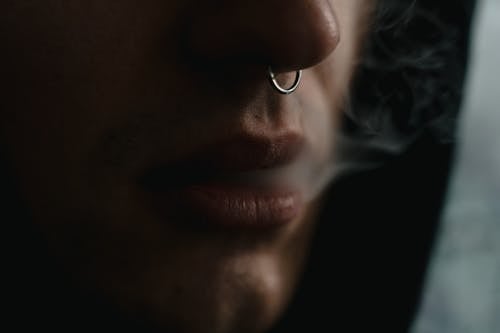 Free Person with Nose Ring Smoking Stock Photo