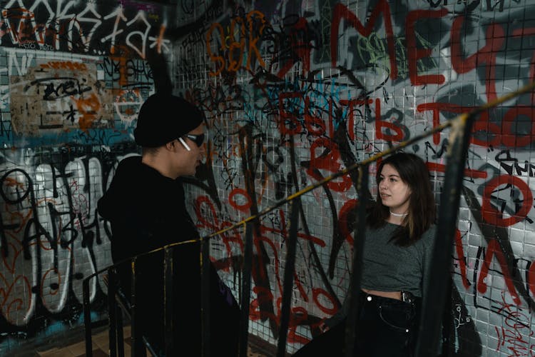 A Man And A Woman Inside An Abandoned Building