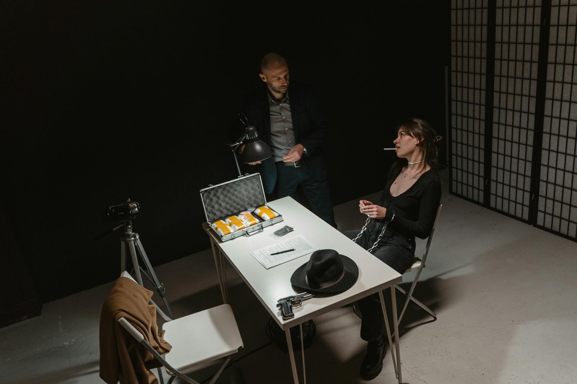 A Woman and a Law Officer Inside the Interrogation Room