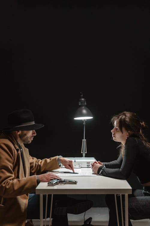 Man and Woman Sitting at Table