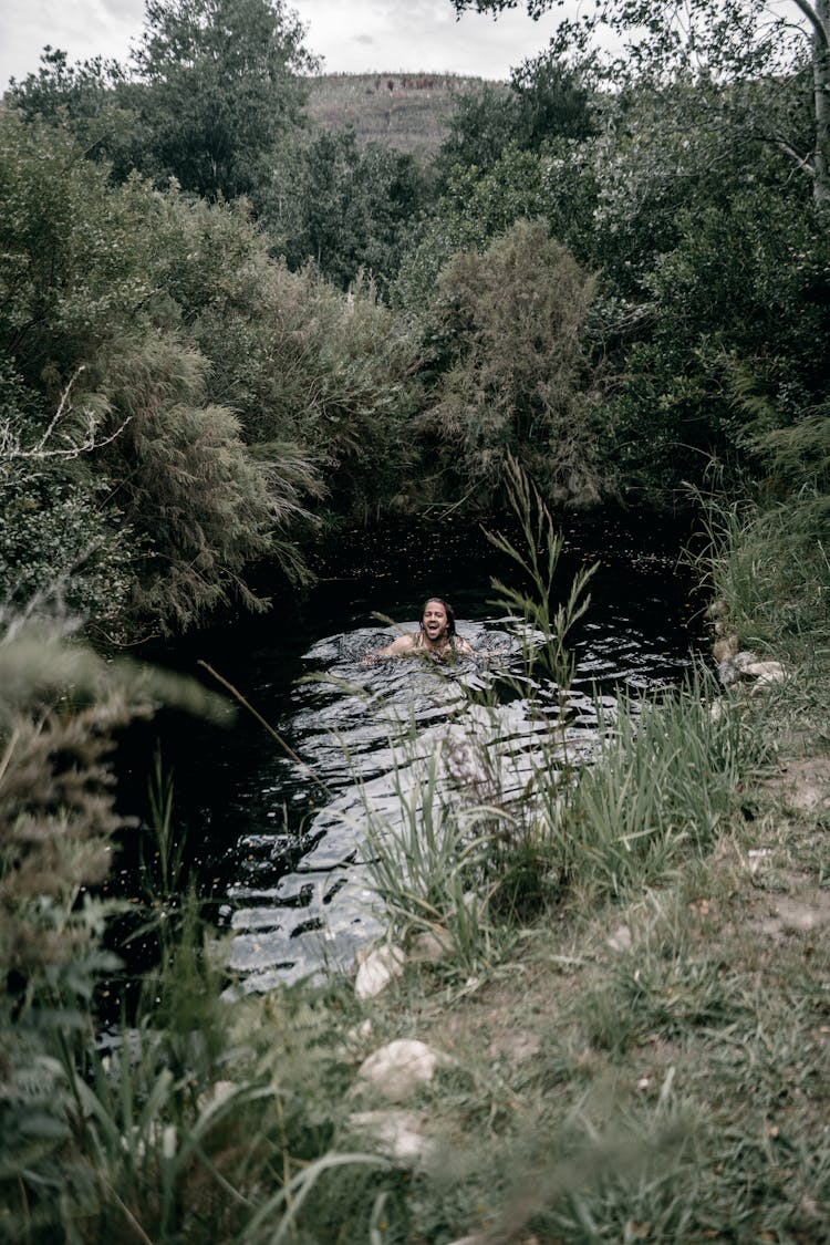 Man Swimming In A River