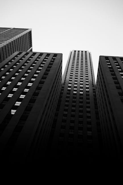 Grayscale Photo of Concrete Building · Free Stock Photo