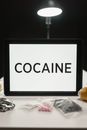 White Board with Cocaine Text and Drugs on Table