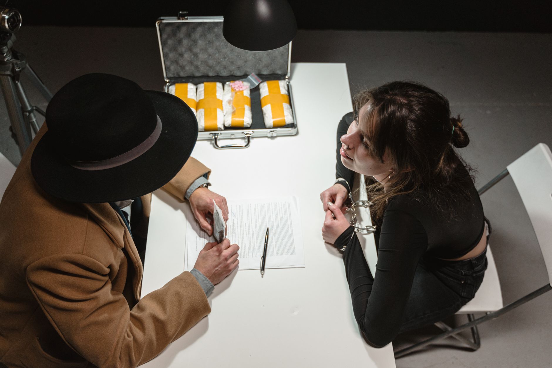 A cautious bettor reviewing a suspicious withdrawal request beside a calculator and identity documents