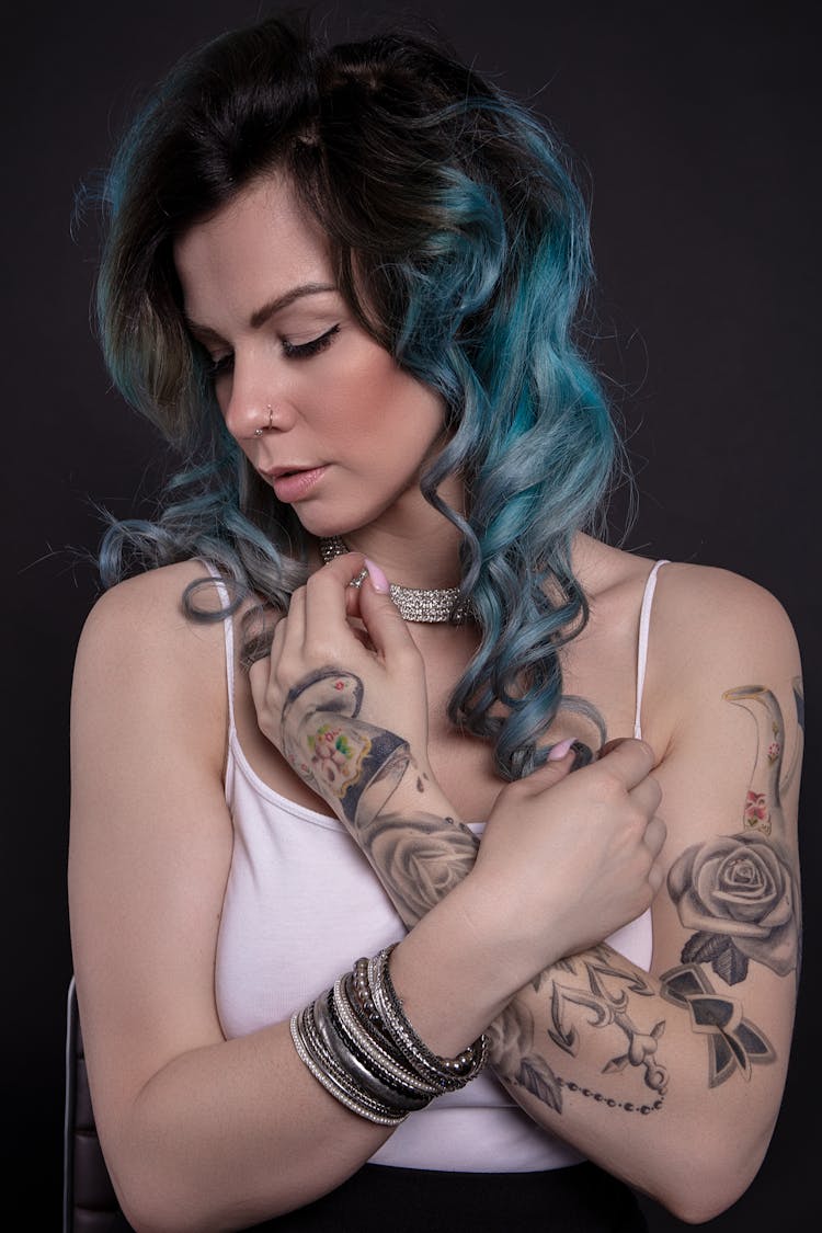 Woman With Tattoo On Left Arm