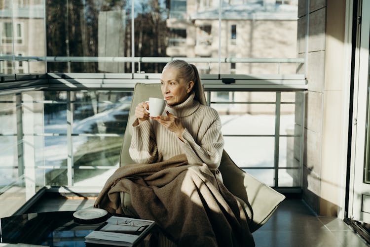 Elderly Woman Drinking Coffee