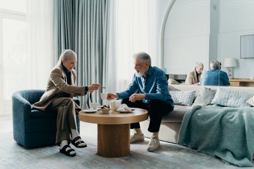 Photo of a Couple Having Coffee Together