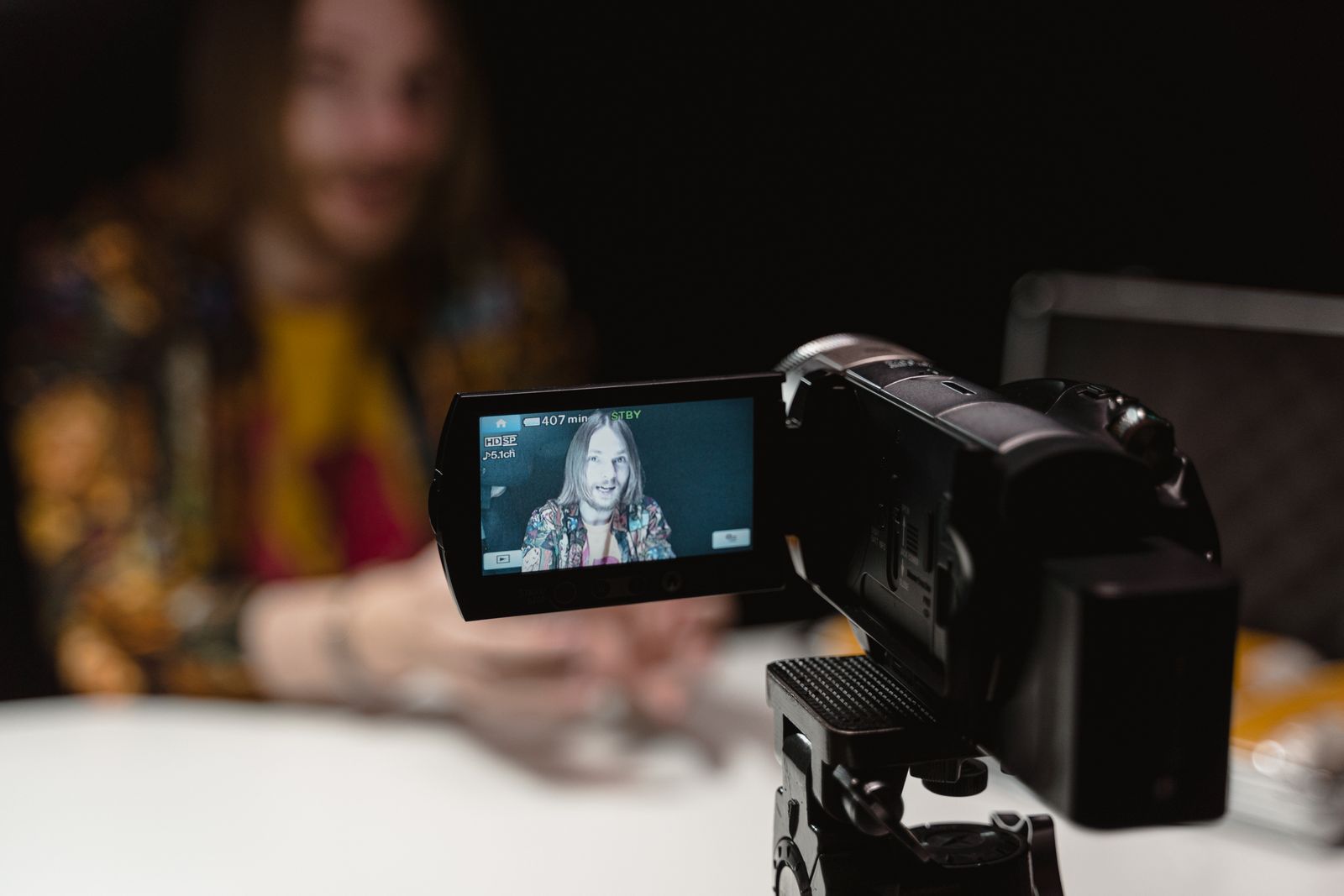 Professional video camera recording a presenter