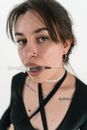 A Woman Biting a Syringe