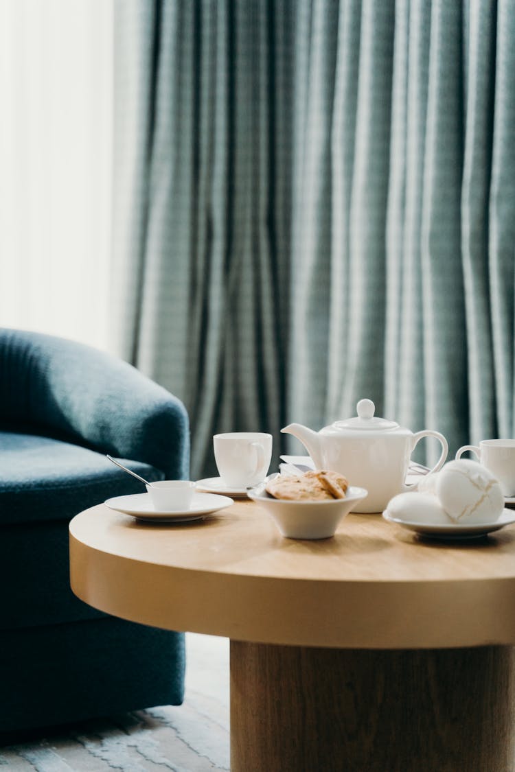 White Tea Cups On Wooden Round Table