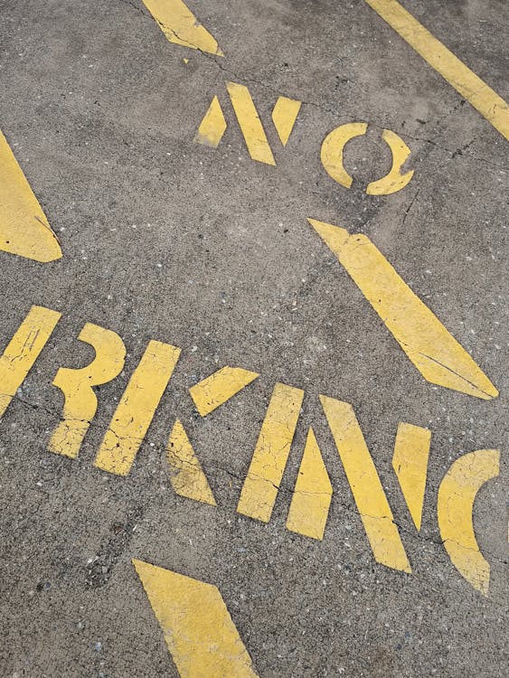 No Parking Written on Concrete Pavement