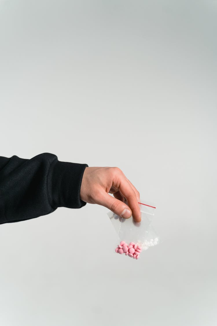 Close-Up Shot Of A Person Holding A Pack Of Drugs