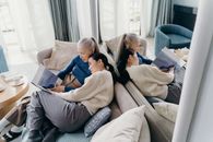 Man and Woman Sitting on Gray Couch