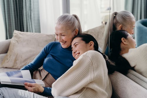 Free Elderly Woman and Young Woman Laughing Together Stock Photo