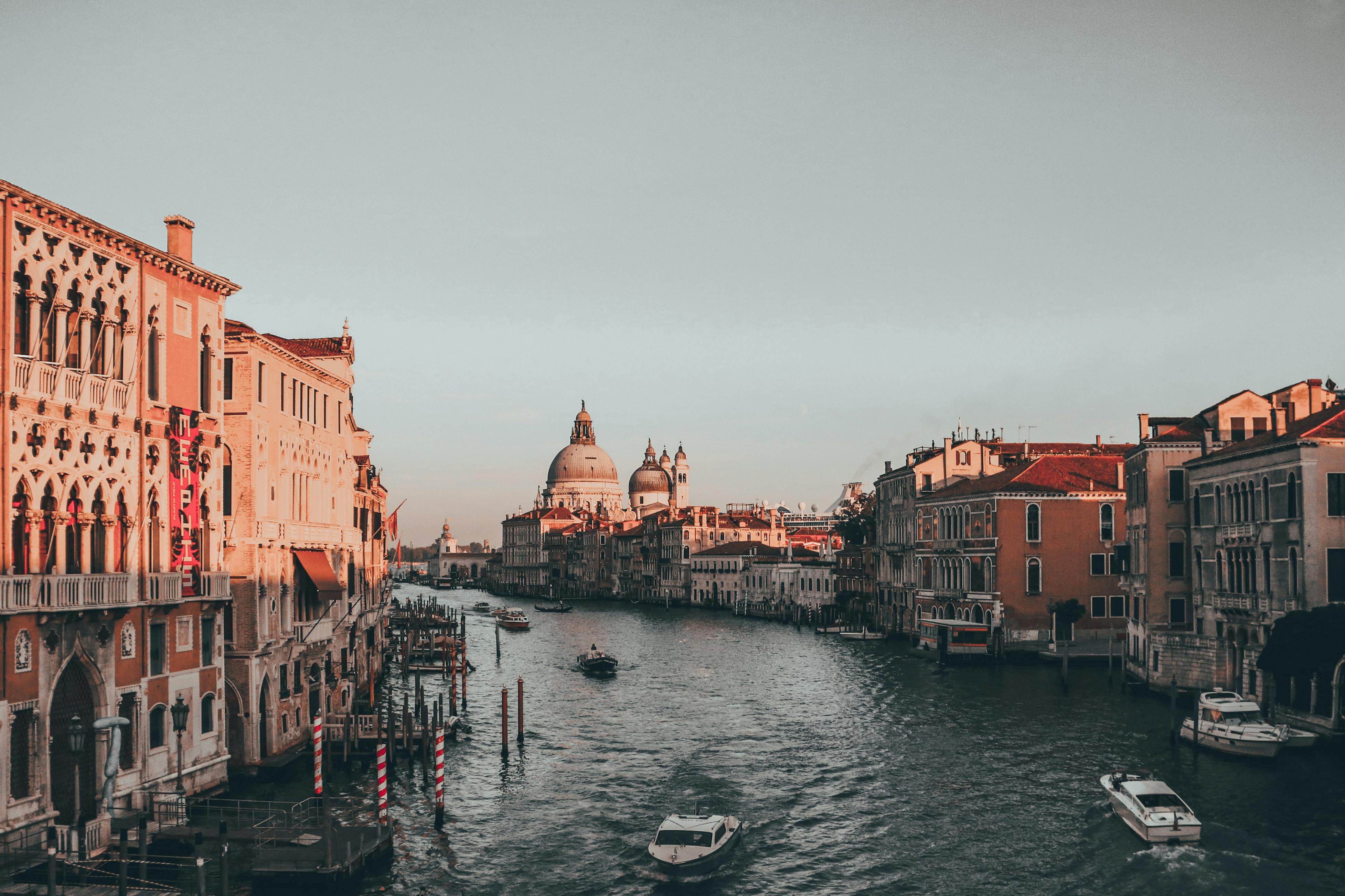 Free A stunning daylight view of Venice's Grand Canal featuring historic architecture and boats. Stock Photo