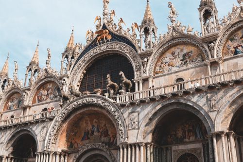 Free Stunning view of St. Mark's Basilica showcasing its Venetian Gothic architecture and intricate mosaics. Stock Photo