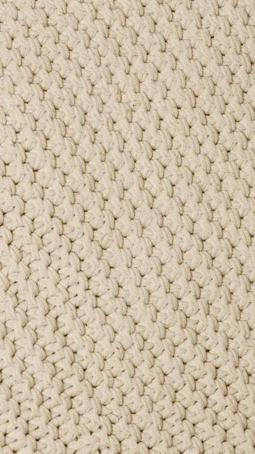 Close-Up Shot of a Beige Knit Textile