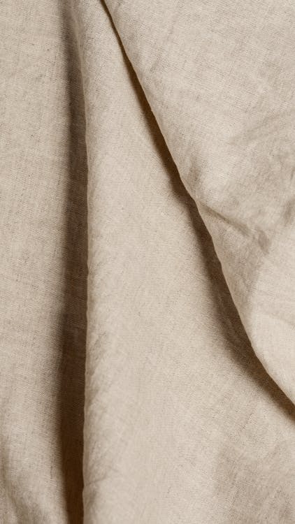 Close-Up Shot of a Beige Textile