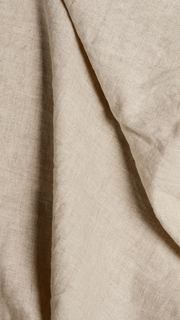Folded beige textile close up — Artem Podrez on Pexels