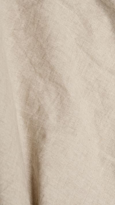 Close view of natural linen cloth — photo by Artem Podrez on Pexels