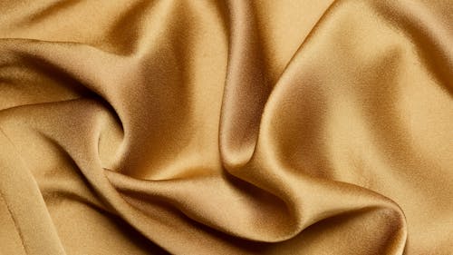 Close-Up Shot of a Gold Textile