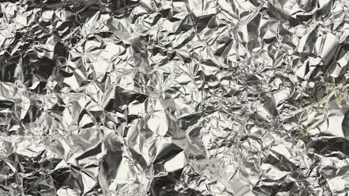 A Crinkled Silver Fabric in Close-up Shot