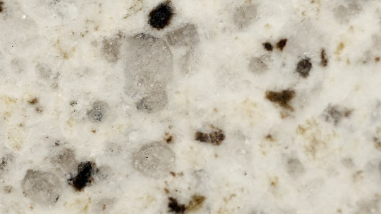 Black And Gray Speckles On Surface