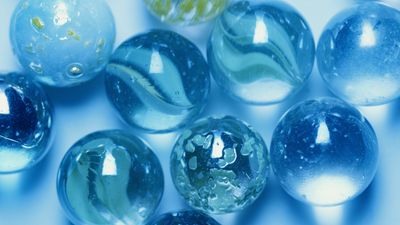 Translucent blue marbles in close-up — photo by Artem Podrez on Pexels