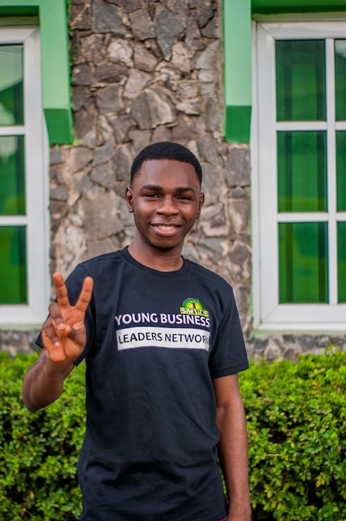 Young Man Posing with Peace Sign