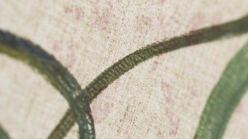 Close-Up Shot of a Beige Textile