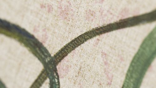 Free Close-up view of a textured fabric featuring abstract patterns in natural hues. Stock Photo
