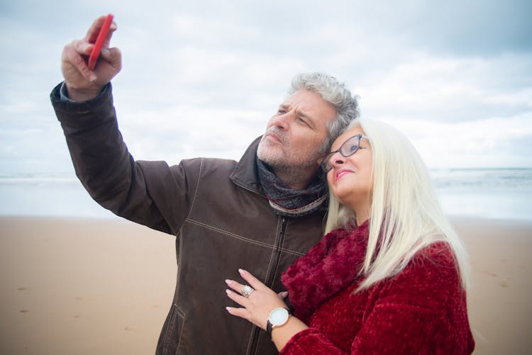 A Mature Couple Taking A Selfie With A Smartphone