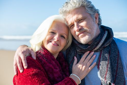 Free Elderly couple sharing a joyful moment by the beach in Portugal, showcasing love and togetherness. Stock Photo