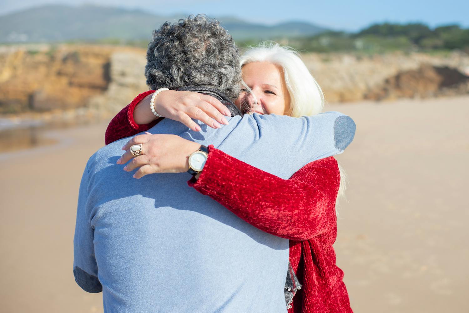 Happy retired couple on beach