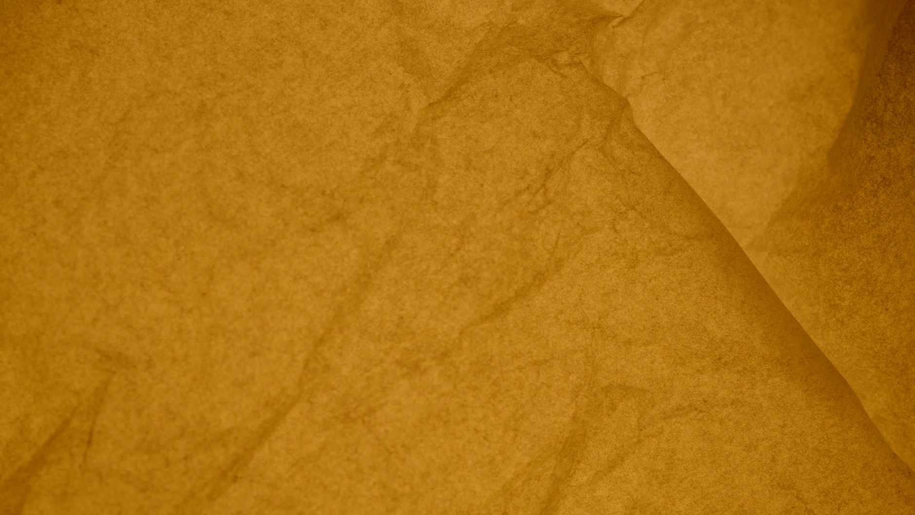 Close-up view of a crumpled yellow paper texture, ideal for backgrounds and designs.. close, view, crumpled