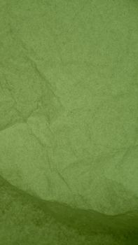 Crumpled green paper texture, perfect for backgrounds or design projects.